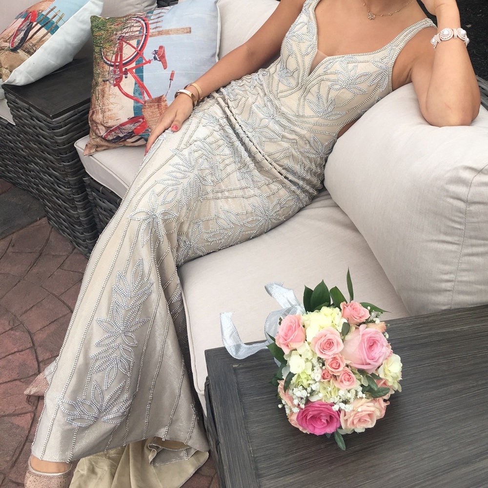 Jovani prom dress in crème color with open back.